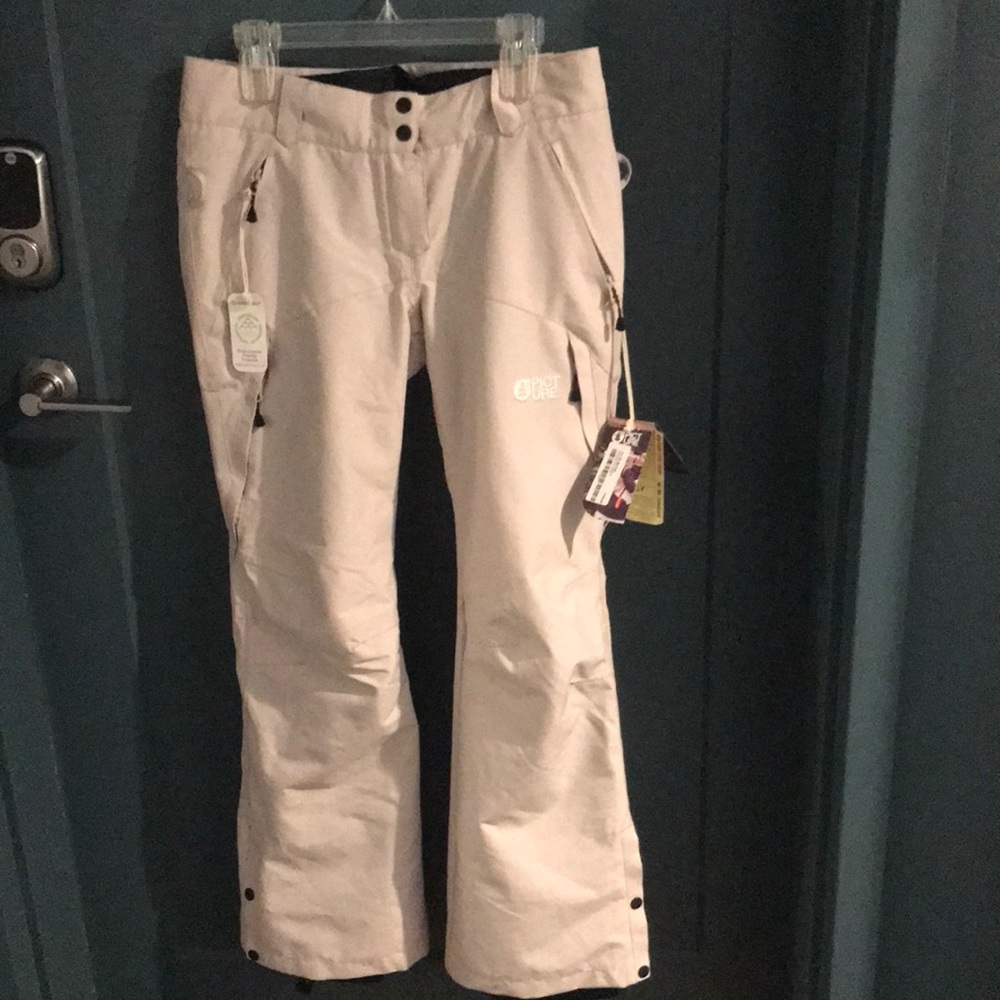 Treva ski pants. Never worn. Still have tags.Light beige in color